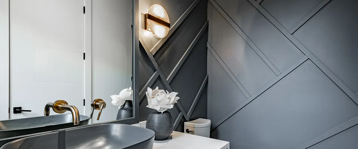 Modern bathroom with gray accent wall and accent lights