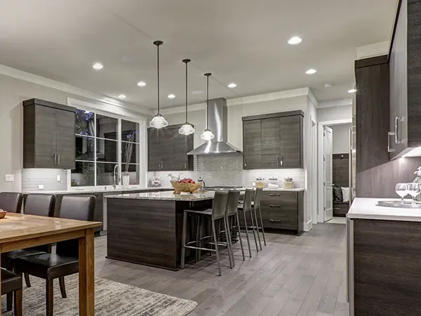 Simple kitchen with gray stock cabinets and kitchen island