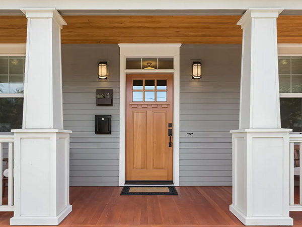 door installation wooden door and wood deck porch