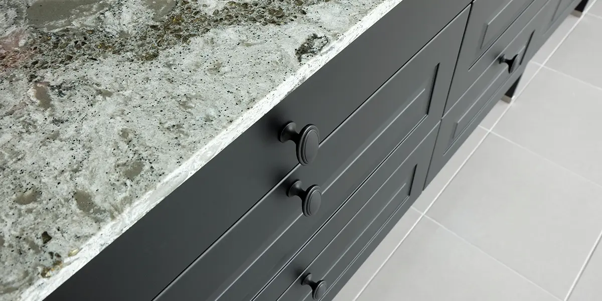 Black base kitchen cabinet with gray granite countertop