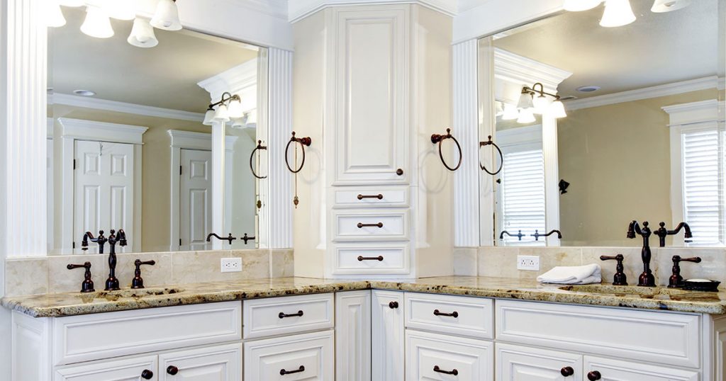 Large traditional bathroom with double vanity and elegant cabinets