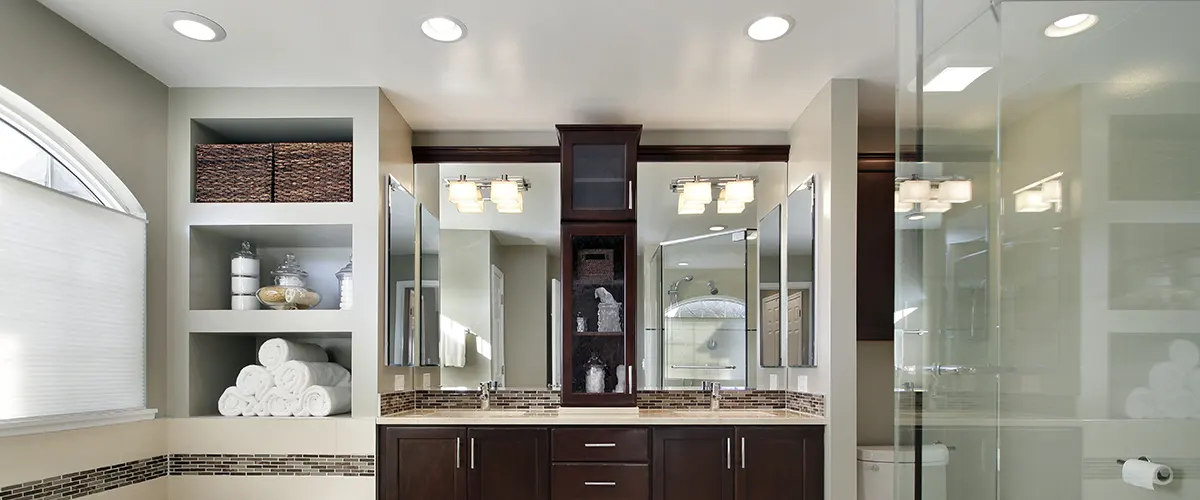 Large bathroom with ceiling lights casting a uniform light