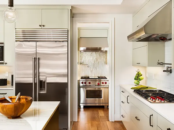 Semi-custom kitchen cabinets with white glossy finish