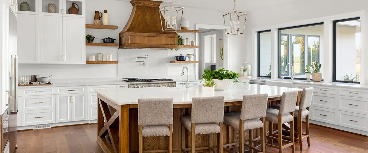 Modern rustic kitchen renovation with white cabinets and matching marble countertops and backsplash