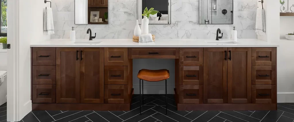 Double hardwood vanity for bathroom with marble walls and black herringbone tile