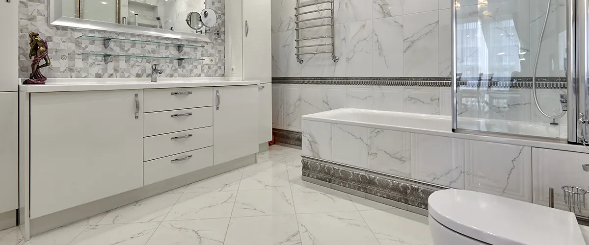 bathroom with white tile flooring