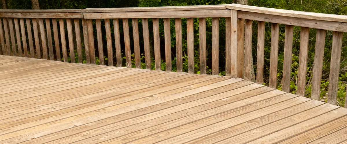 Pressure treated deck with wood railing