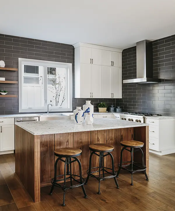Wood island in a kitchen with white cabinets